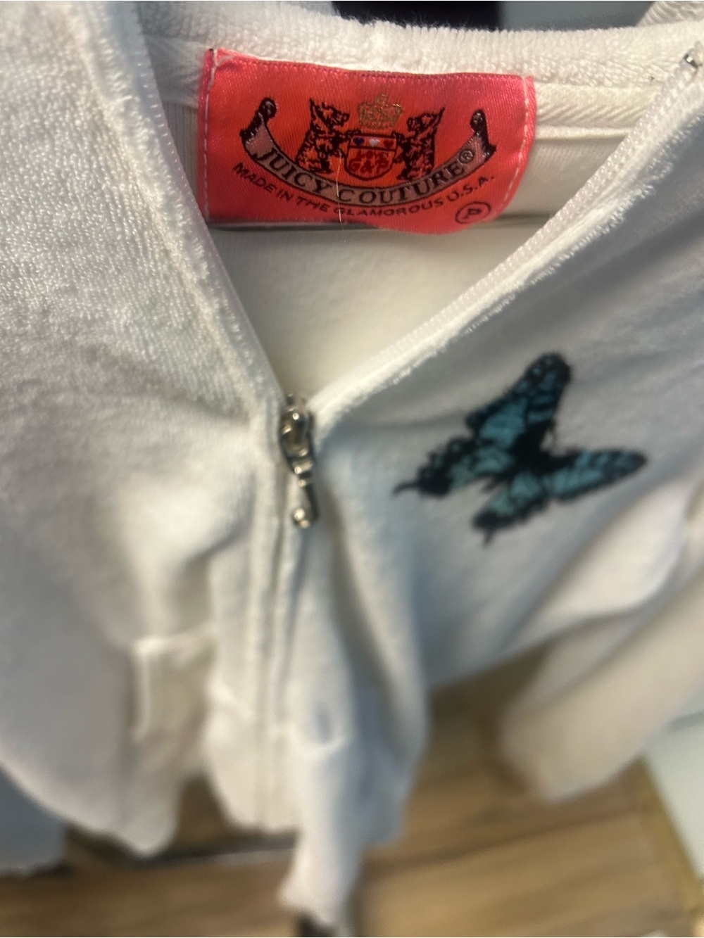 Juicy Couture White Zip Hoodie with Blue Butterfly Accent